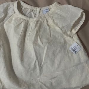 The brand is from old navy. It’s cream color it was never worn.very affordable.